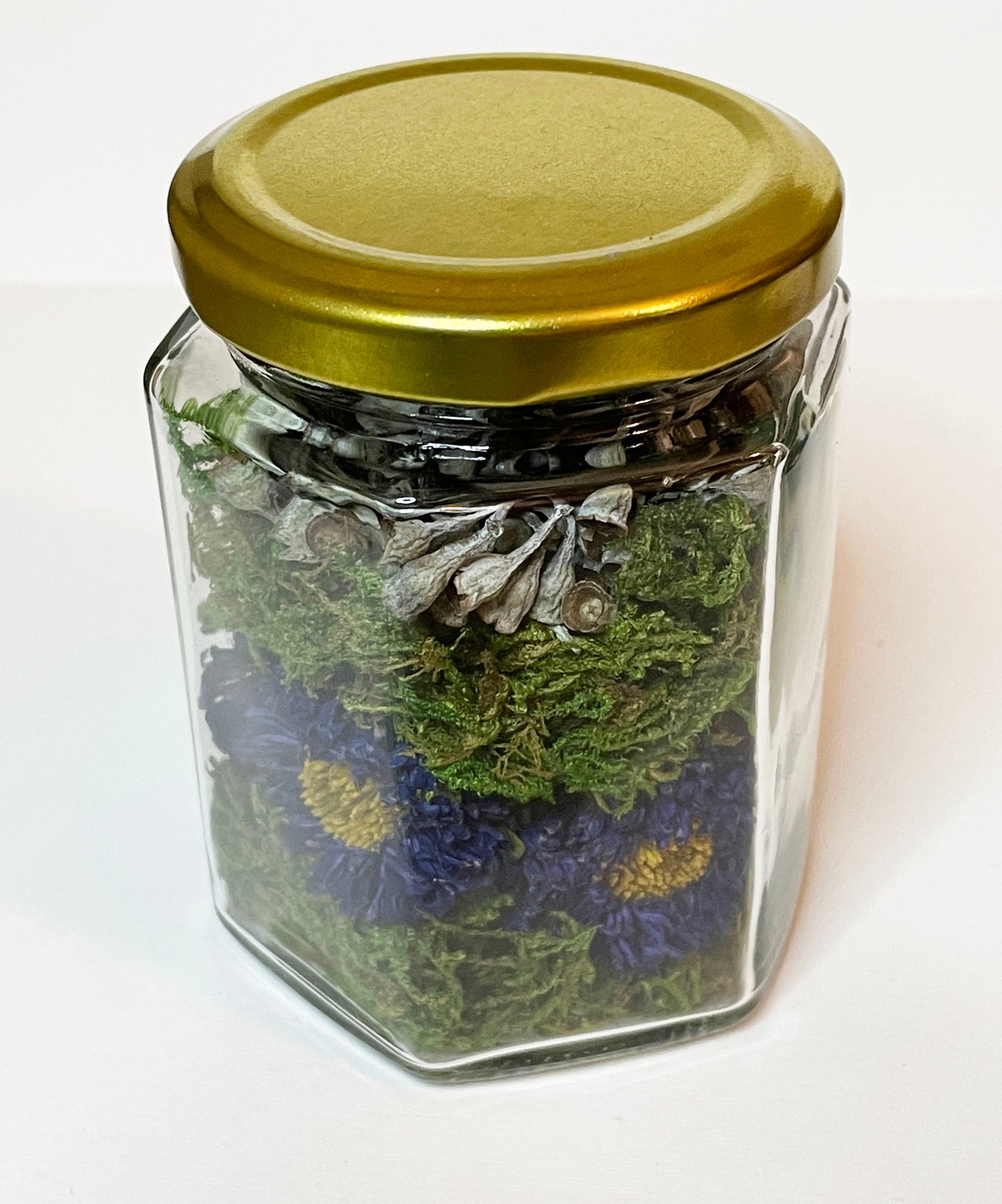 Dried Purple Asters with Seeded Eucalyptus in Honeycomb Shaped Glass Jar with Gold Lid